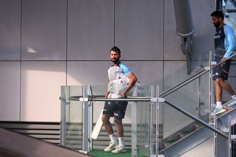 Cheteshwar Pujara on his way to the ground for a batting session.