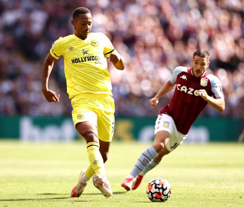 Pinnock (left) grabbed the assist for Brentford's first ever Premier League goal