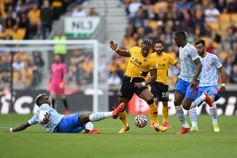 Adama Traore (centre) in action for Wolverhampton Wanderers.
