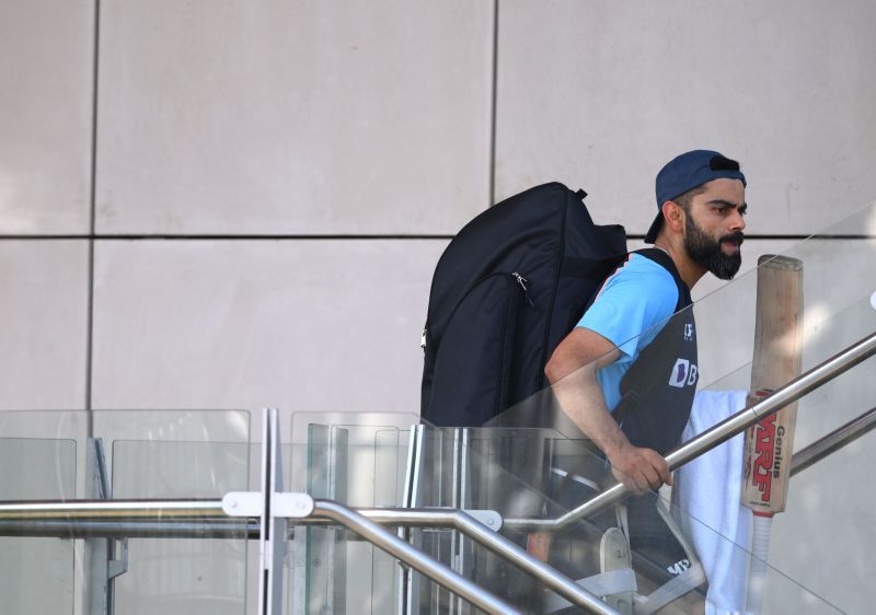 Virat Kohli heads back to the pavallion after sweating it out in the nets.