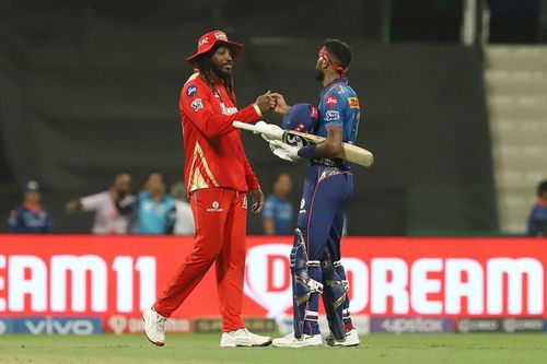 Chris Gayle (L) and Hardik Pandya fistbump after MI's win. (PC: IPLT20.com)