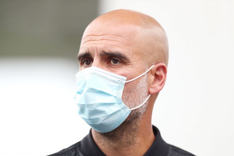 Manchester City manager Pep Guardiola looks on