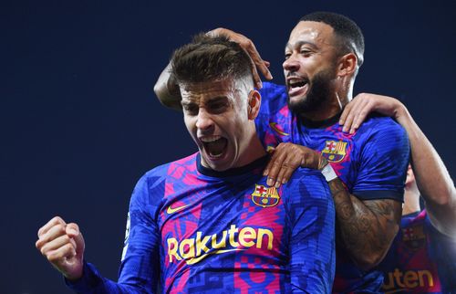 Gerard Pique (left) exults after a landmark strike on Wednesday.