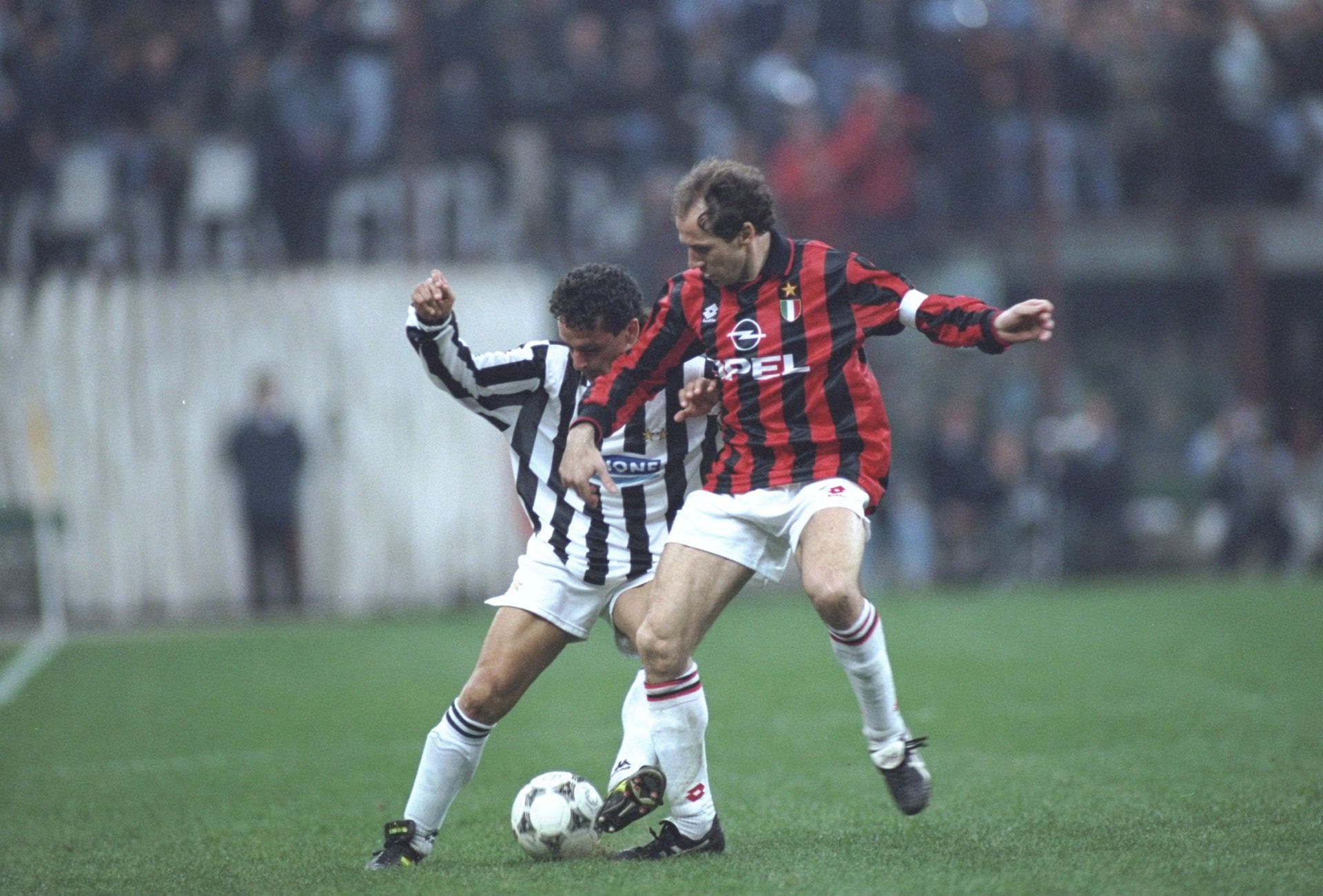 Roberto Baggio of Juventus and Franco Baresi (right) of AC Milan