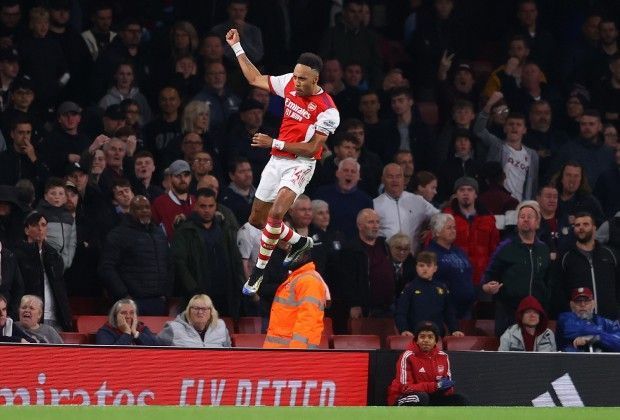 Aubameyang wheels away in celebration after scoring.