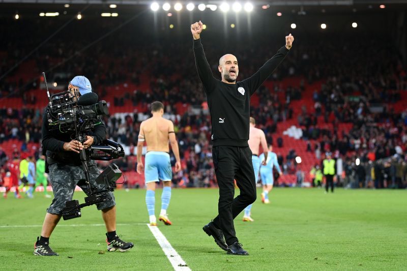 Manchester City boss Pep Guardiola celebrates during his team&#039;s Premier League game against Liverpool