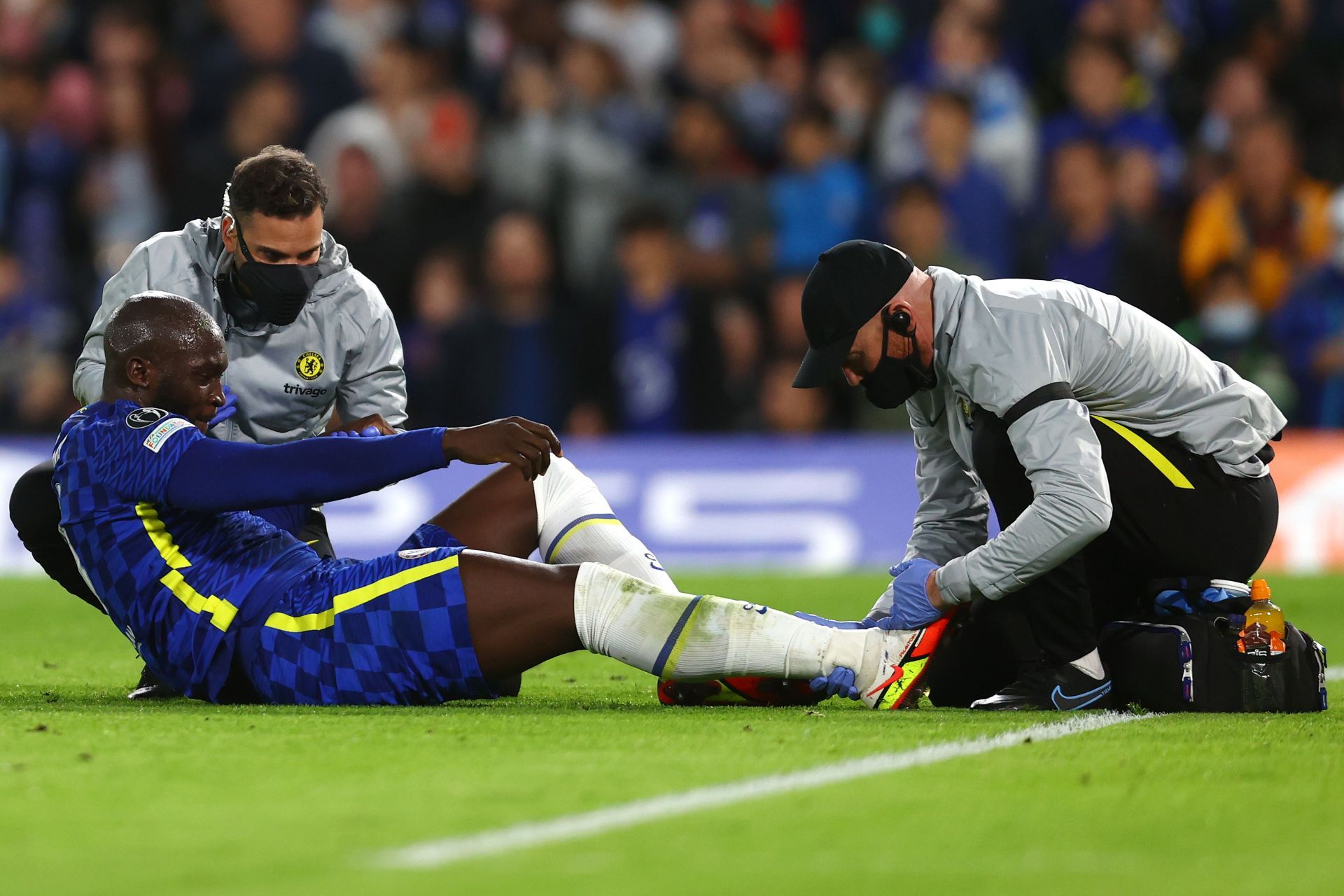 Romelu Lukaku receives medical treatment during the game.