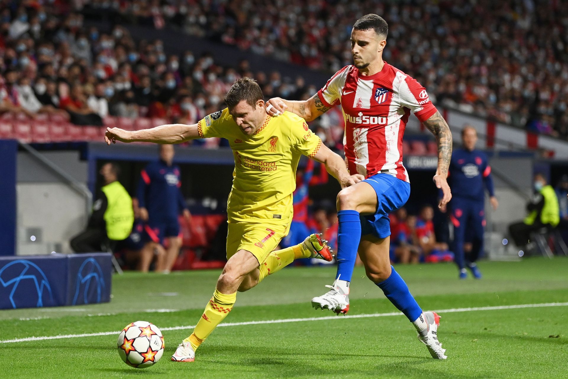 James Milner of Liverpool is challenged by Mario Hermoso