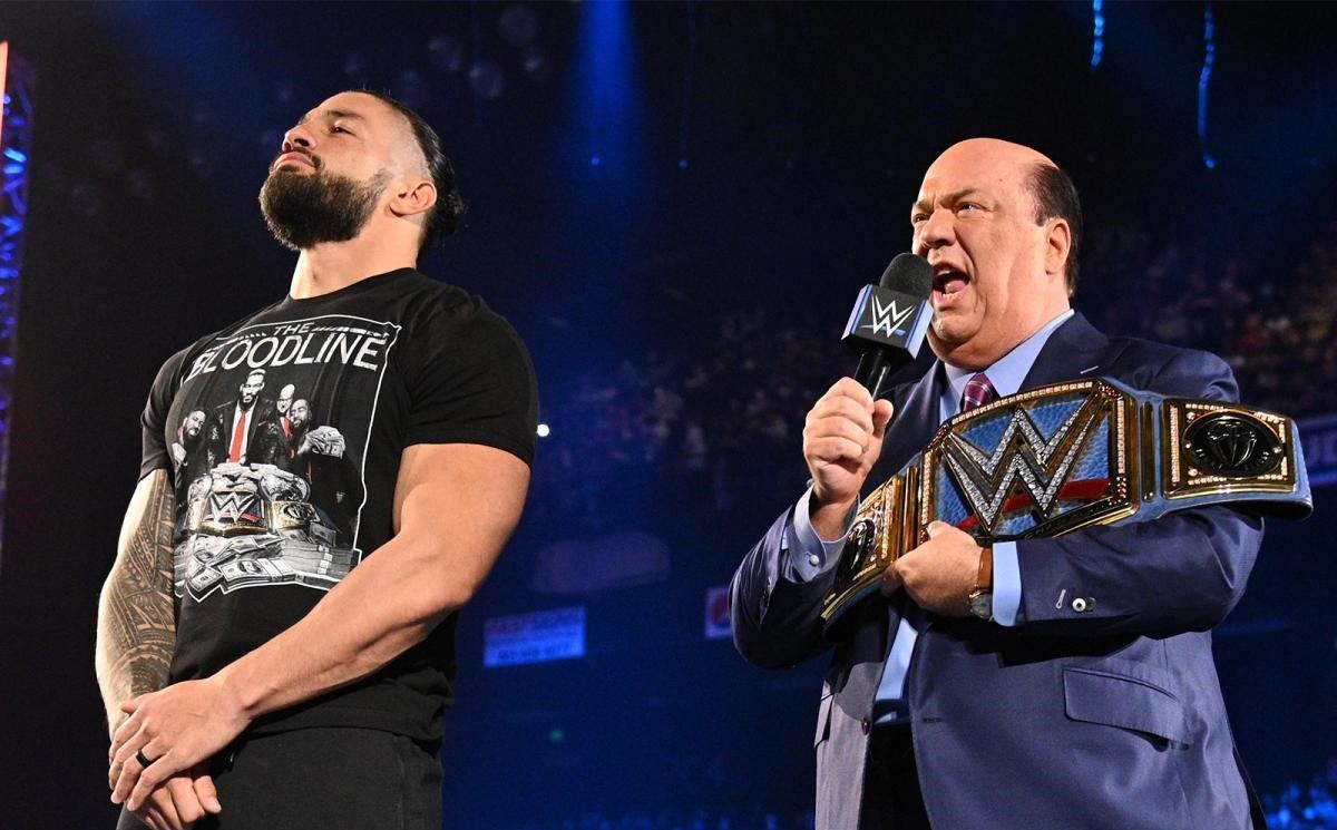 Paul Heyman alongside The Tribal Chief and WWE Universal Champion Roman Reigns