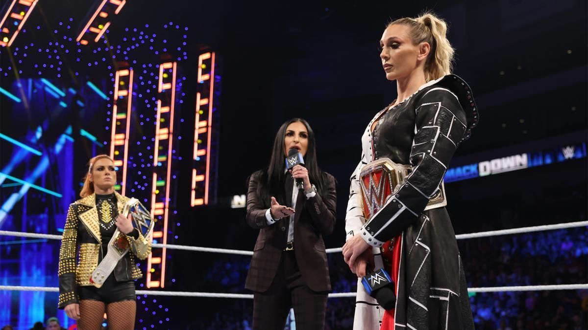 Charlotte Flair in the ring on SmackDown with Becky Lynch and Sonya Deville