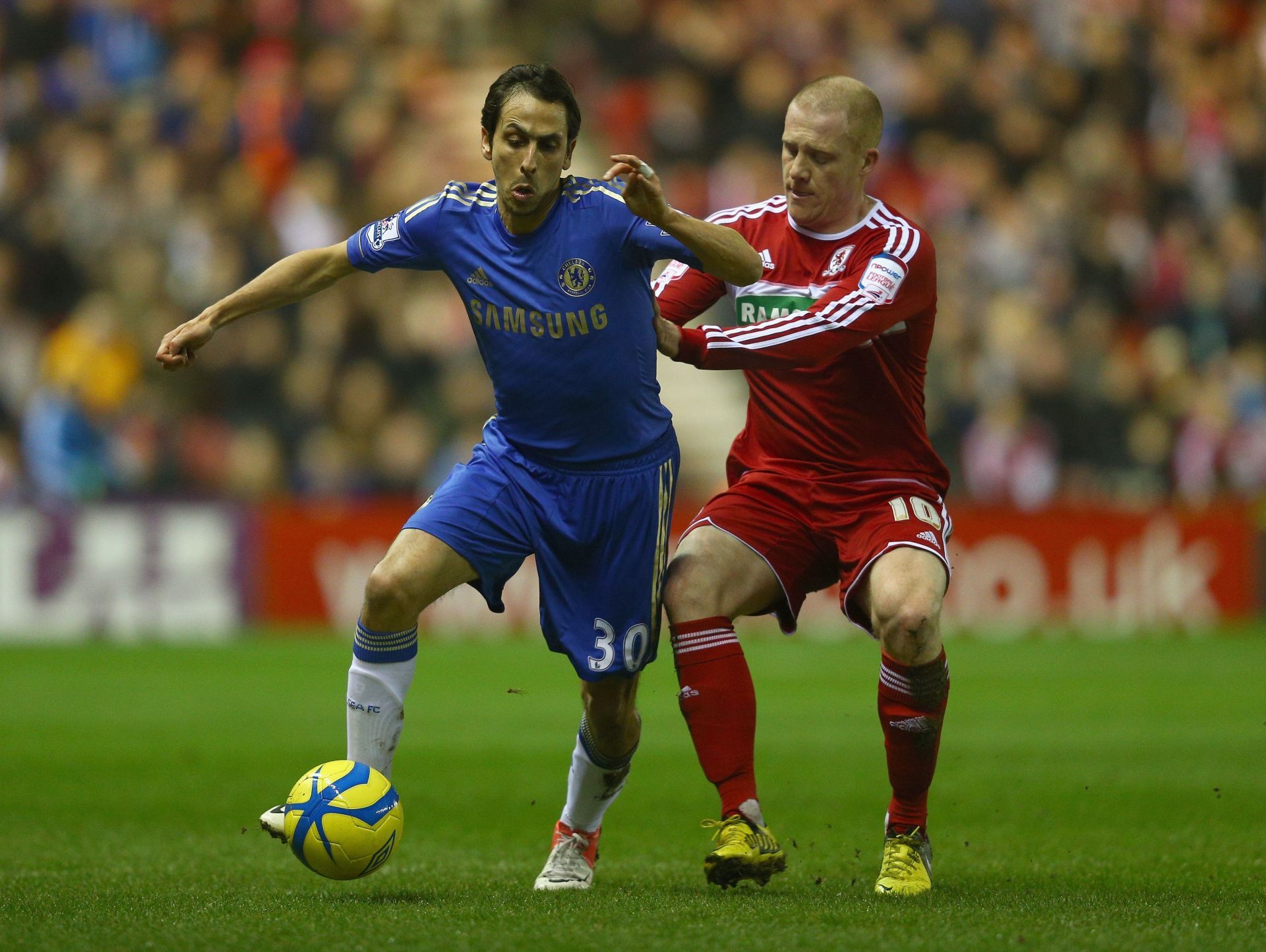 Former Chelsea midfielder Yossi Benayoun (left).