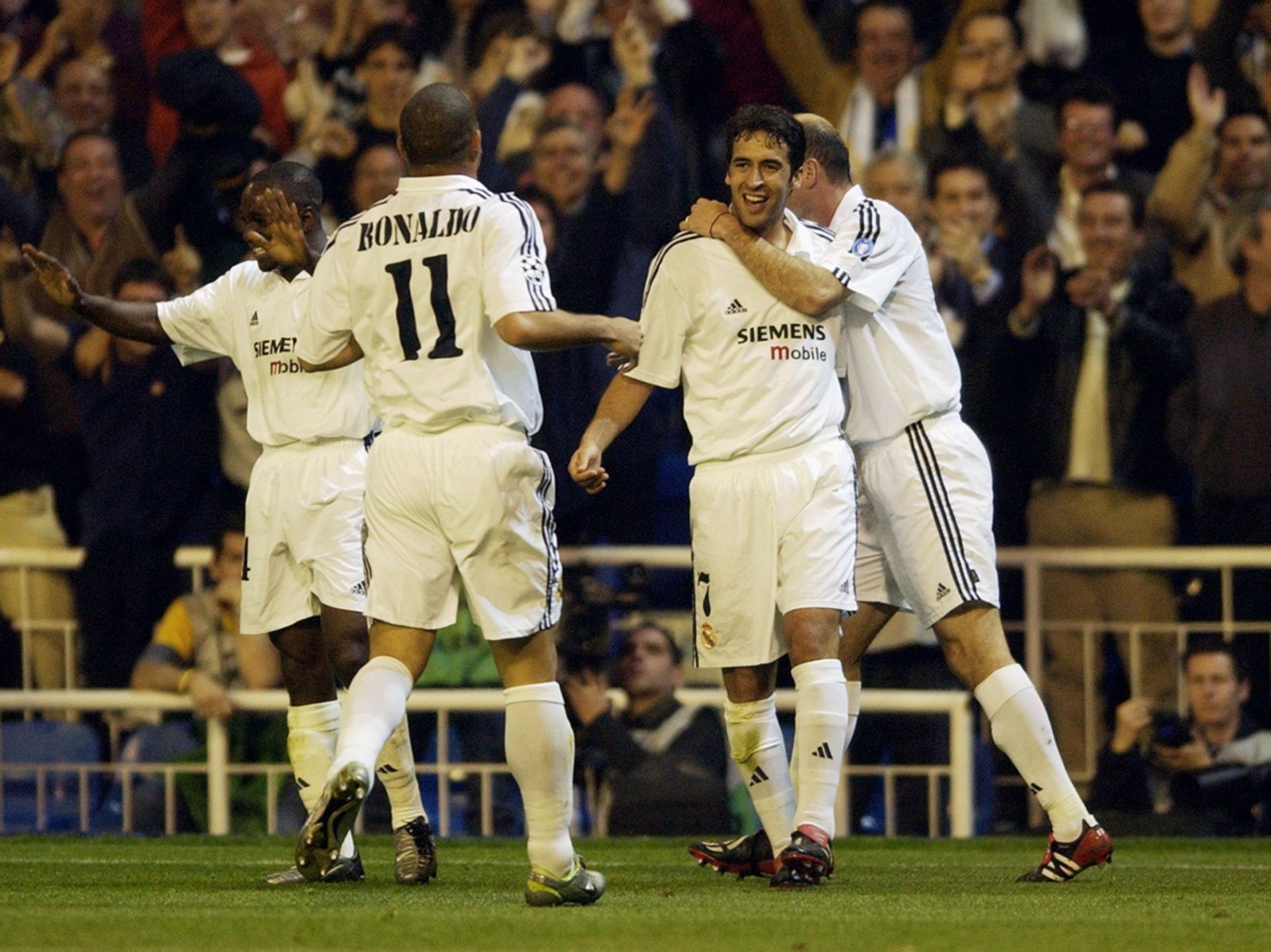 Raul of Real Madrid celebrates scoring the second goal with team-mates Ronaldo and Zinedine Zidane