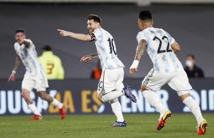 Lionel Messi celebrates scoring Argentina&#039;s first goal against Uruguay.