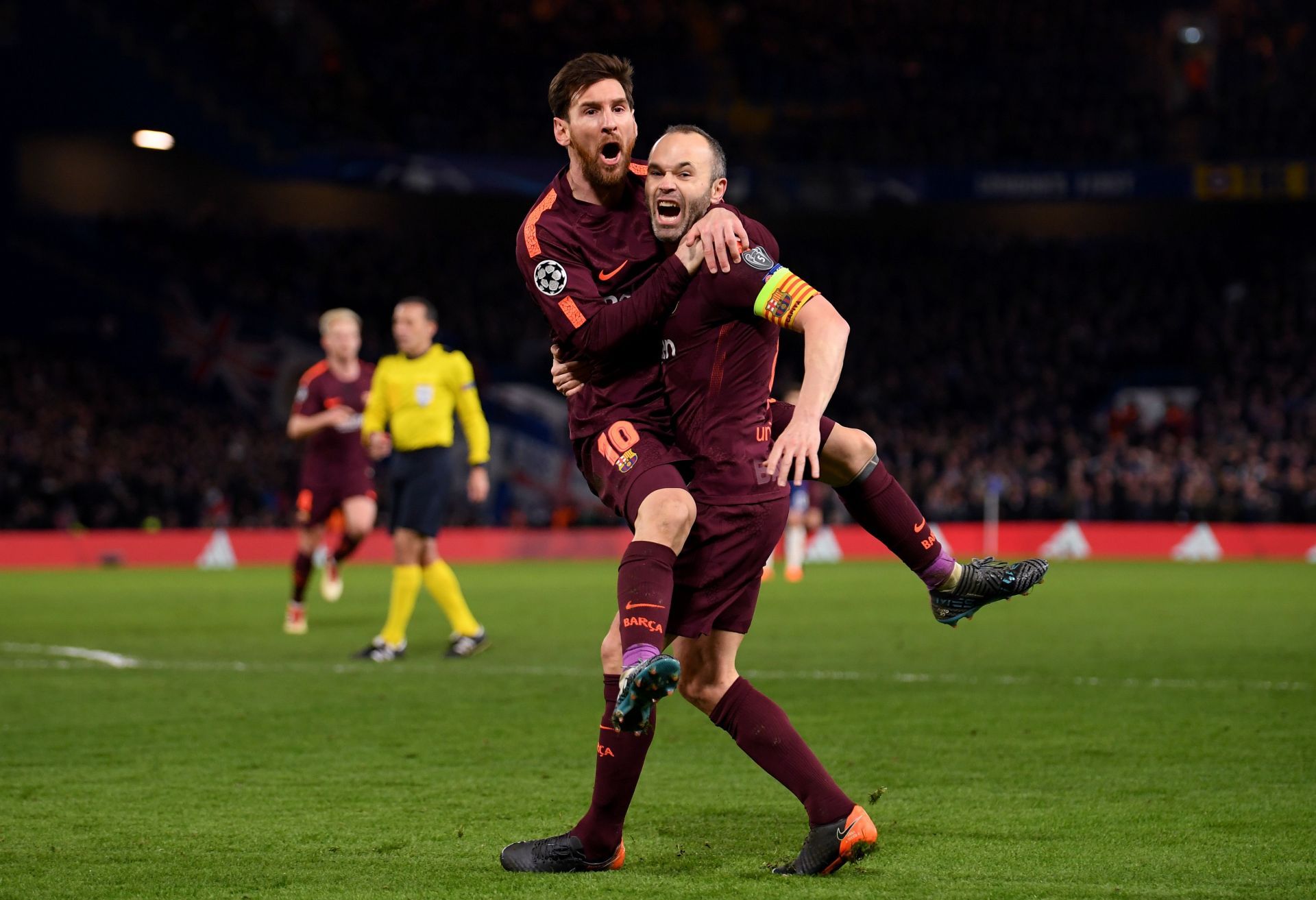 Iniesta celebrating with Messi