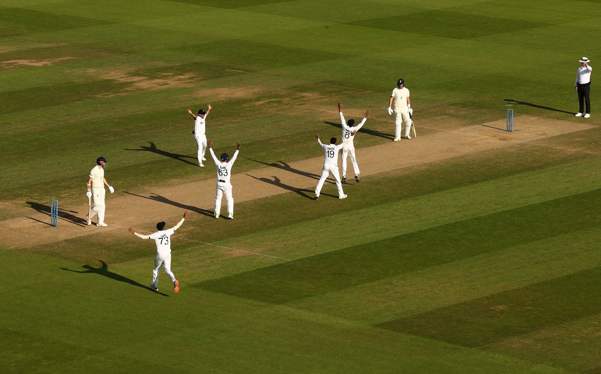 Indian team players celebrate the fall of James Anderson's wicket