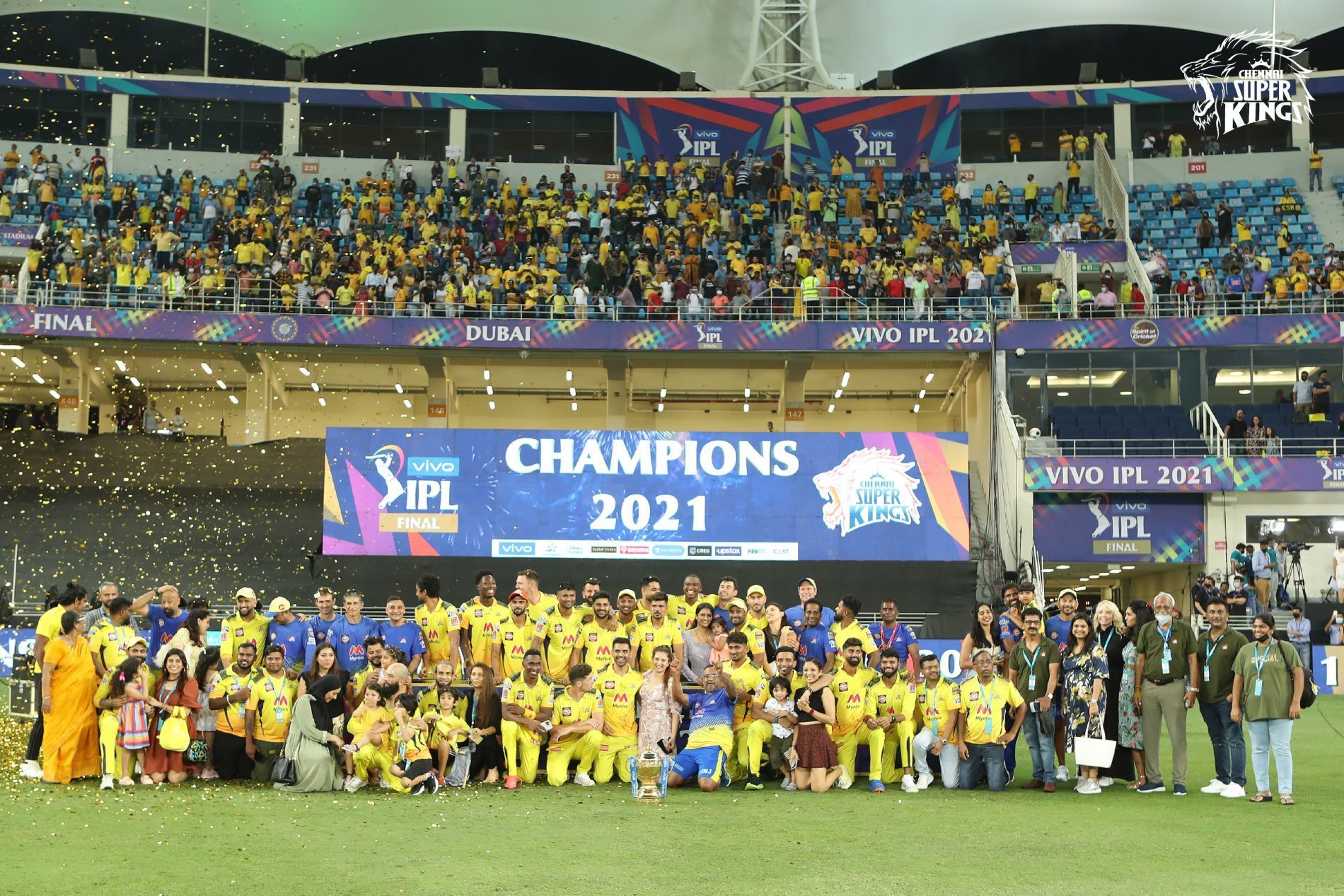 Sea of Yellow: The Chennai Super Kings (CSK) family pose with the trophy. Pic: CSK/ Twitter