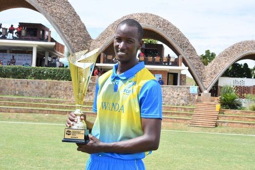 Rwanda's skipper poses with the trophy. (Image Credits; Twitter)