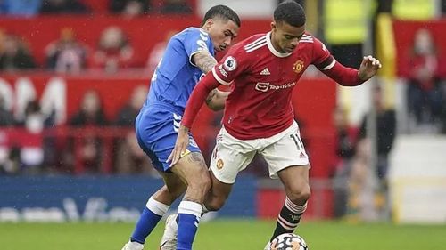 Mason Greenwood tries to get past an Everton player in today's match