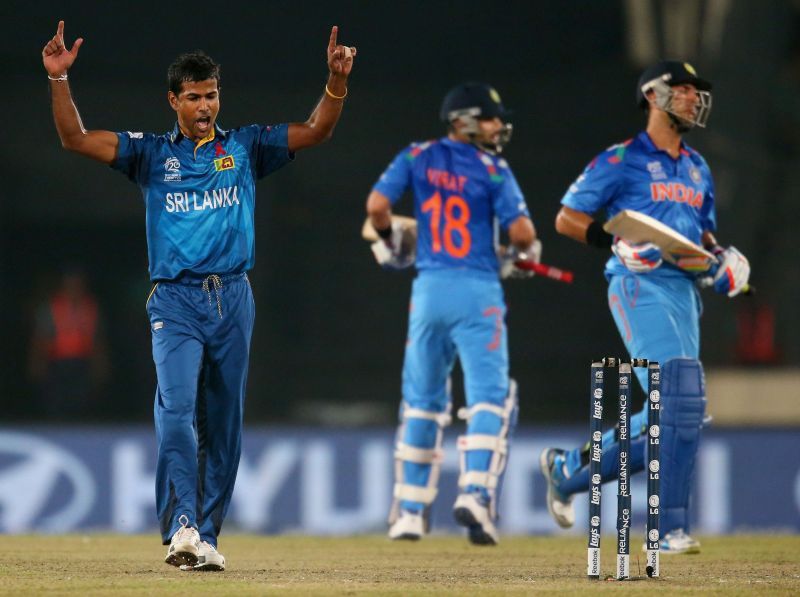 Nuwan Kulasekara celebrates after dismissing Yuvraj Singh (R) in the 2014 T20 World Cup final. Pic: Getty Images
