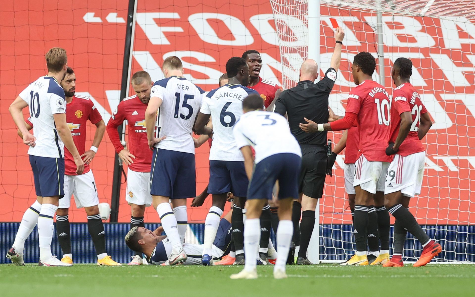 Referee Anthony Taylor shows a red card to Anthony Martial during the match between Manchester United and Tottenham Hotspur
