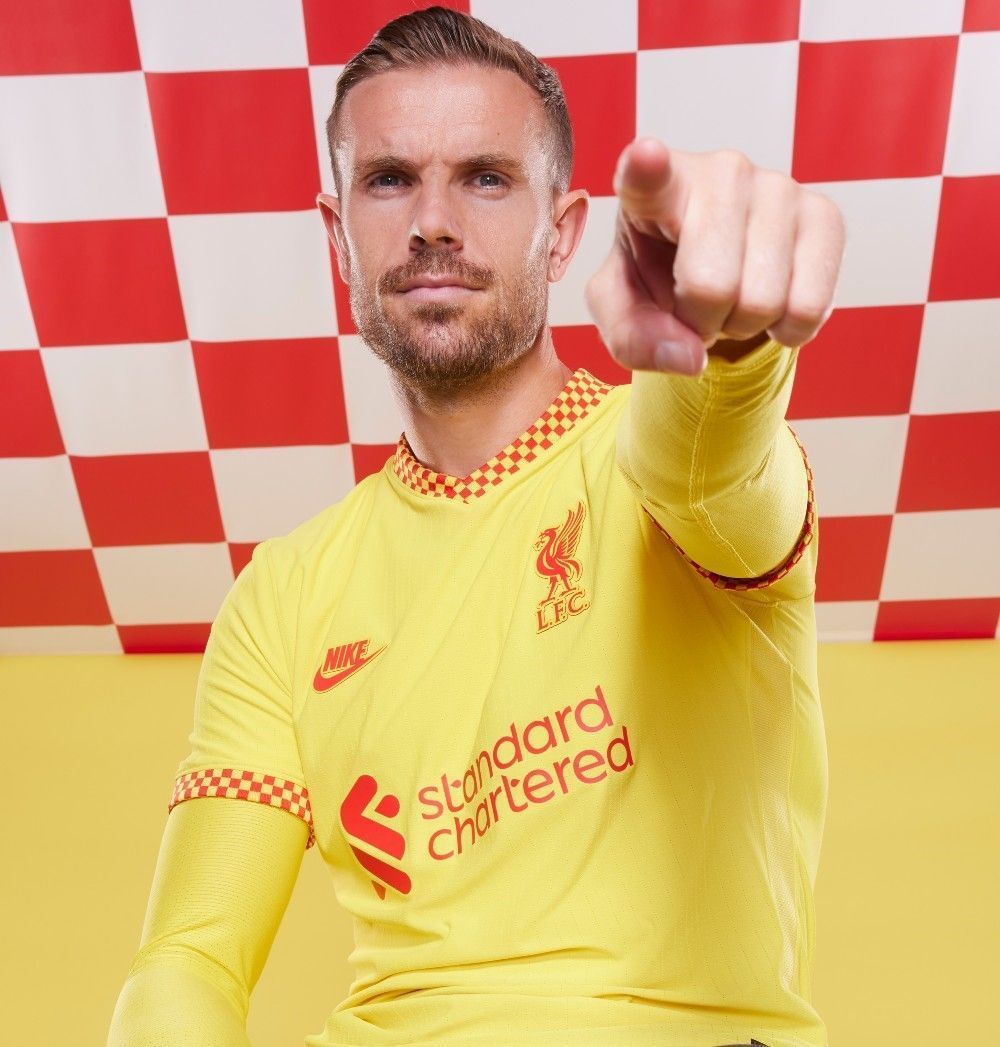 Liverpool captain Jordan Henderson psoing in their third kit