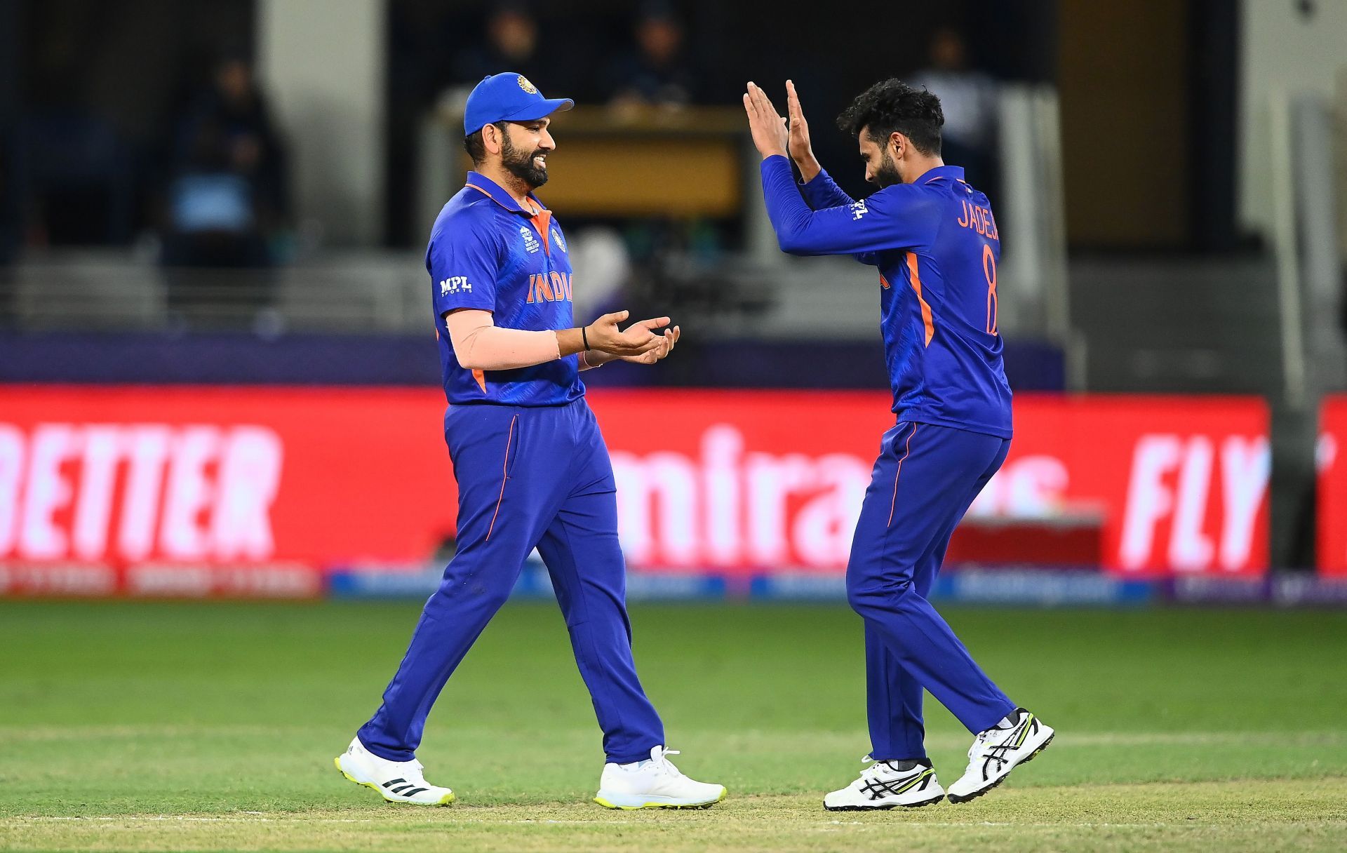 Ravindra Jadeja (right) celebrates a wicket with Rohit Sharma. Pic: Getty Images