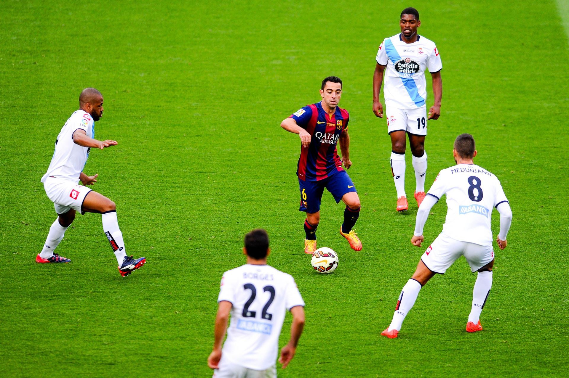 Former Barcelona player Xavi in action for the club