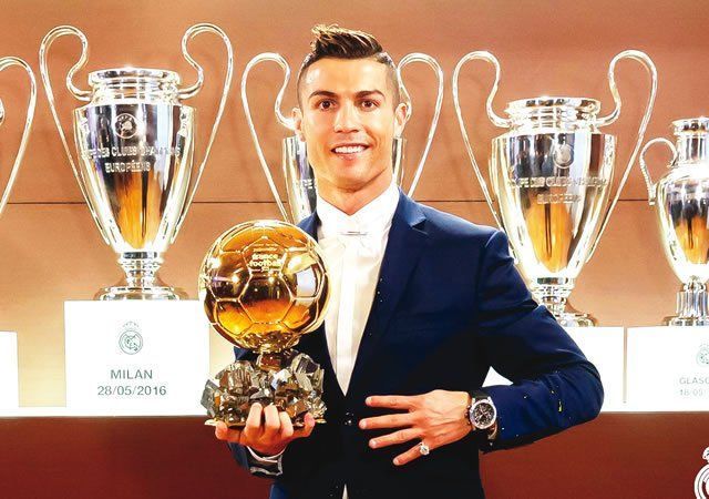 Cristiano Ronaldo poses with his fourth Ballon d&#039;Or award.