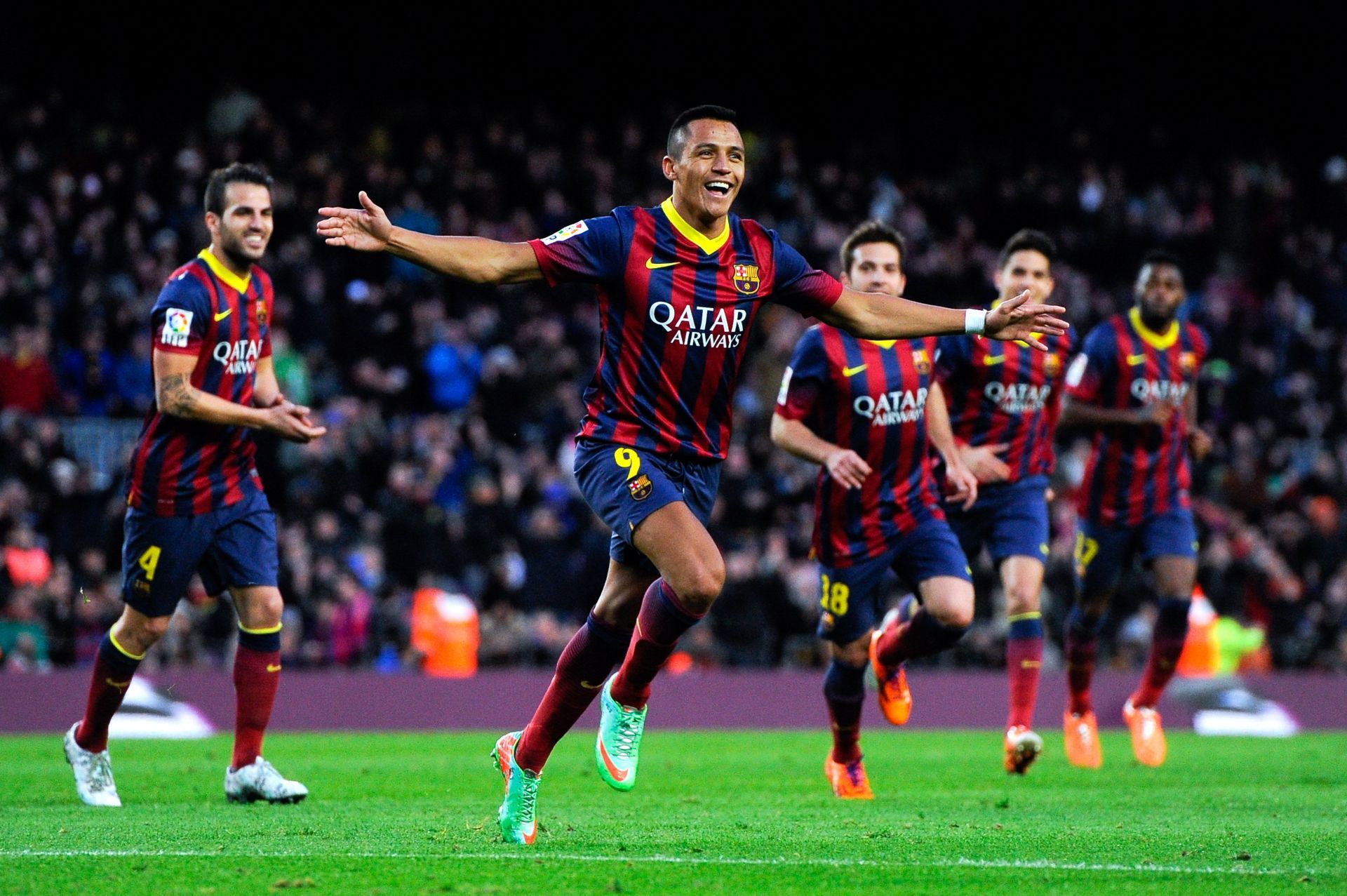 Alexis Sanchez celebrating with his teammates while at Barcelona.