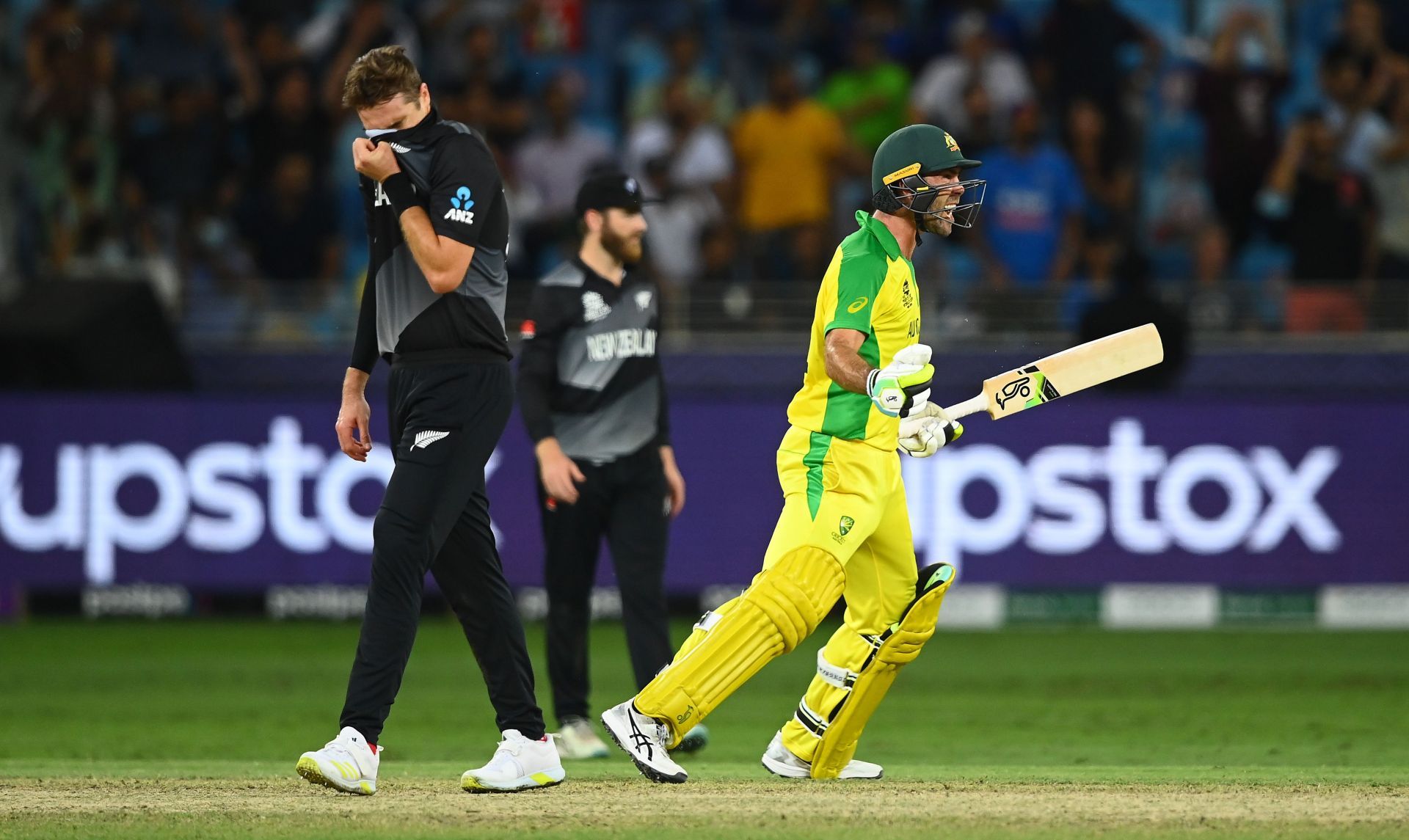 Glenn Maxwell celebrates while Tim Southee is dejected after Australia&rsquo;s T20 World Cup triumph. Pic: Getty Images