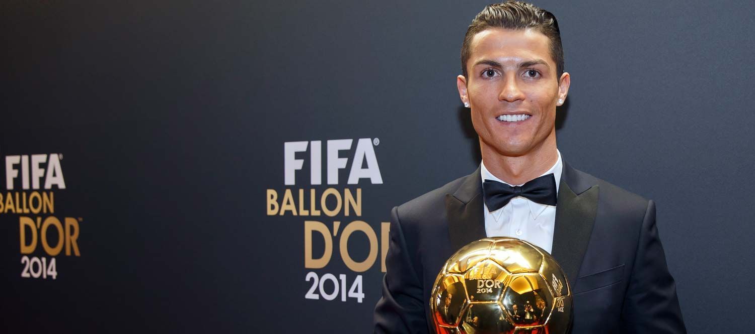 Cristiano Ronaldo posing with his third Ballon d&#039;Or award.