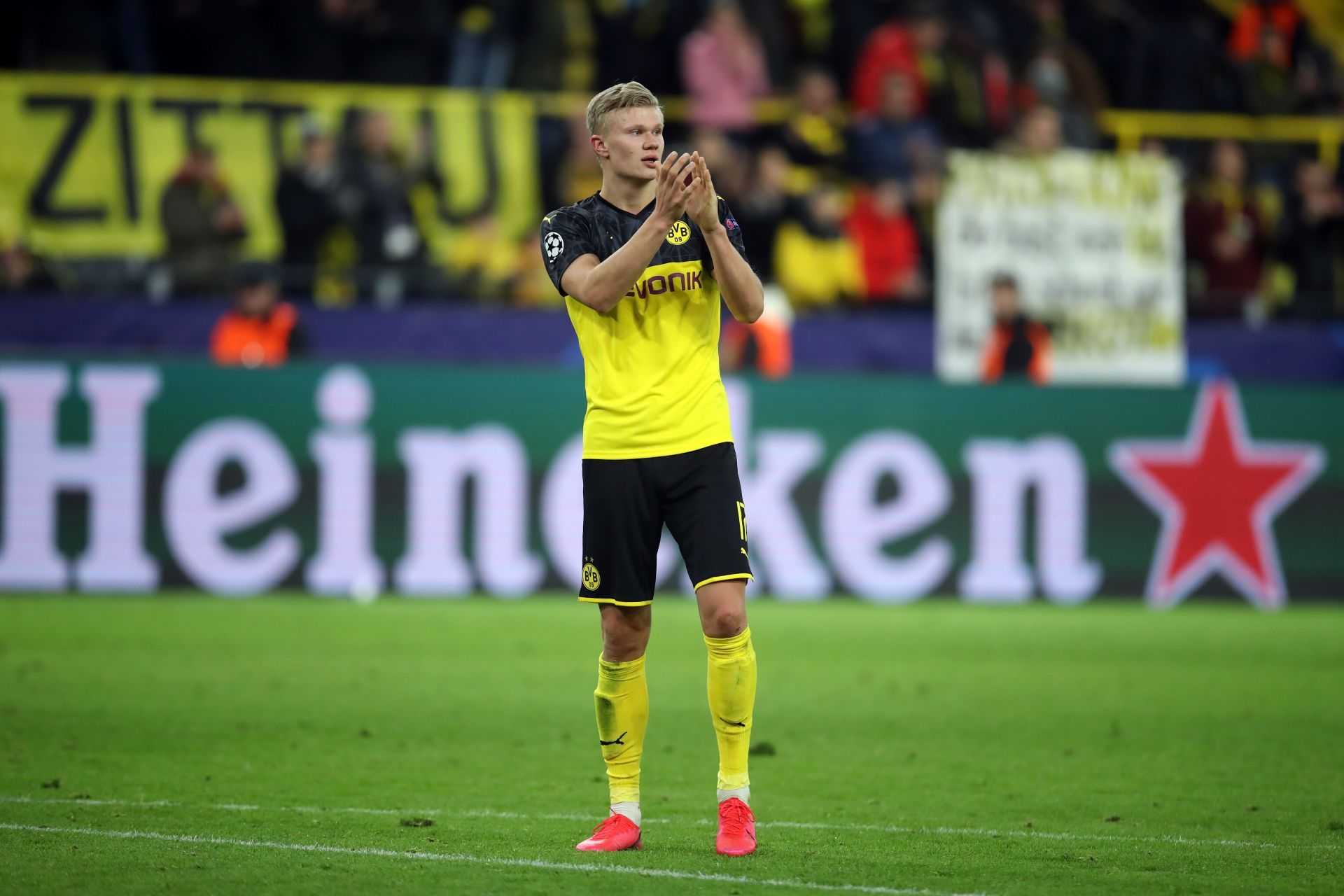 Erling Haaland applauds the Dortmund fans after a game against Lionel Messi&#039;s current club PSG.