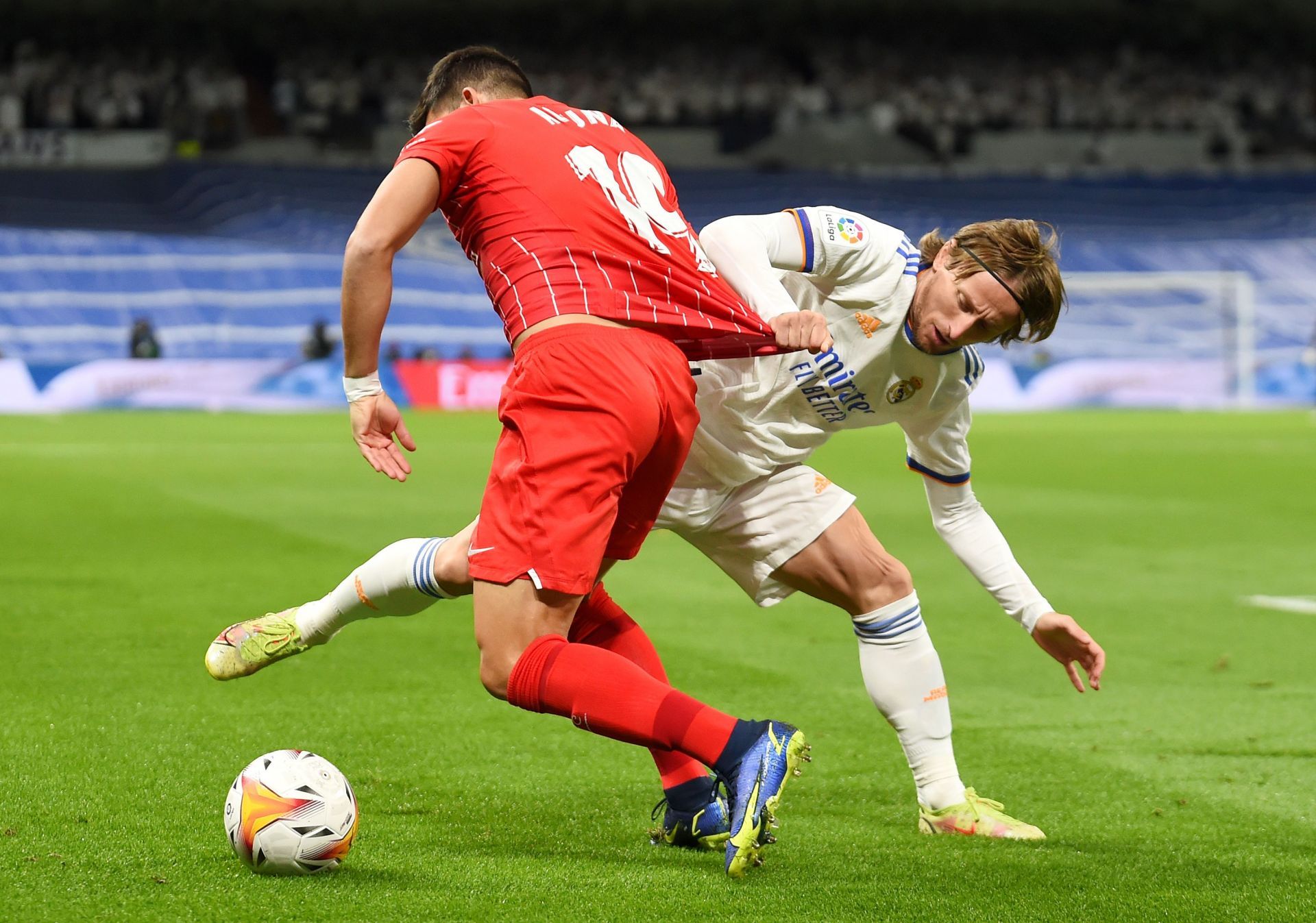 Luka Modric tussles for the ball
