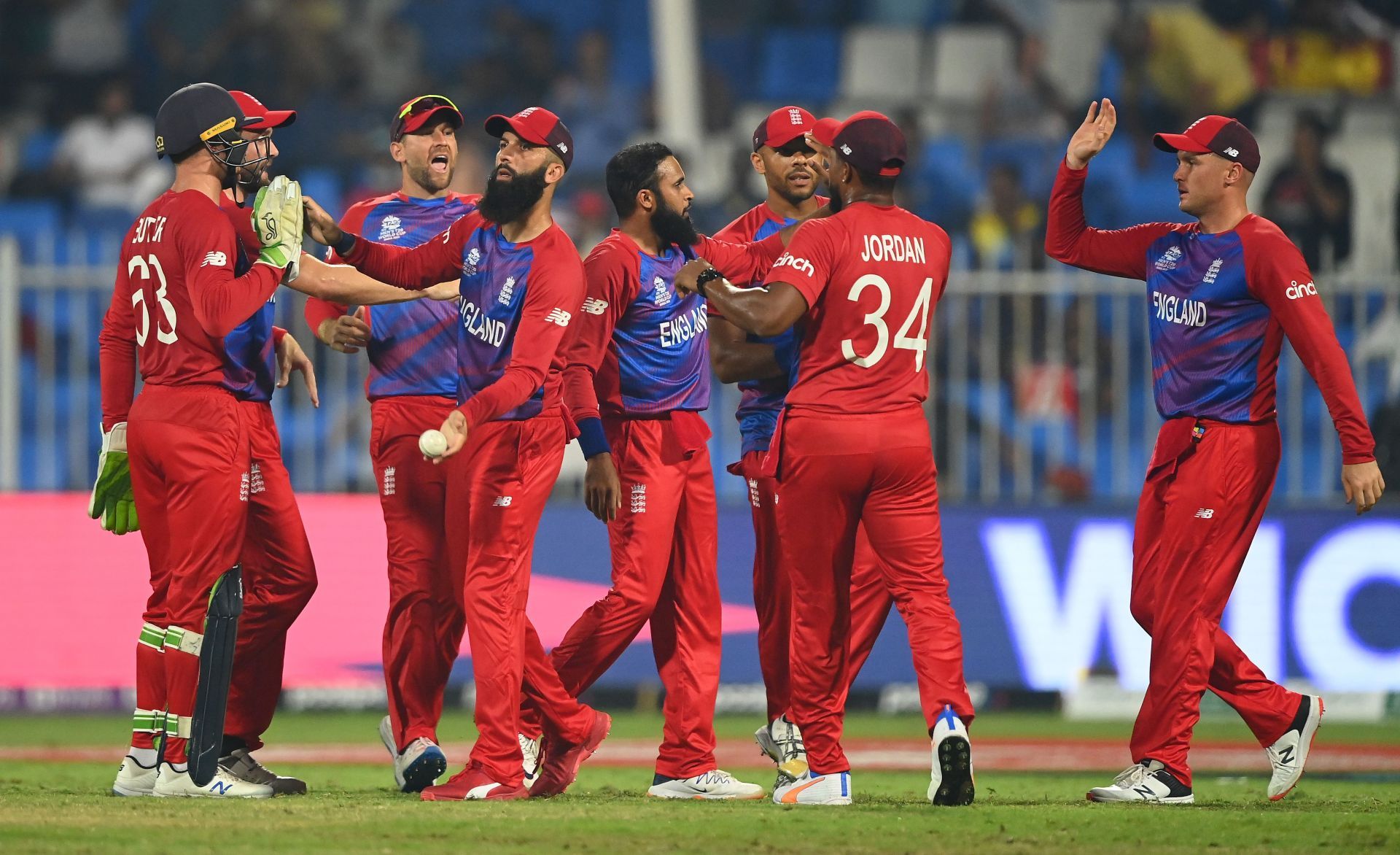 England team celebrating the fall of a Sri Lankan wicket.