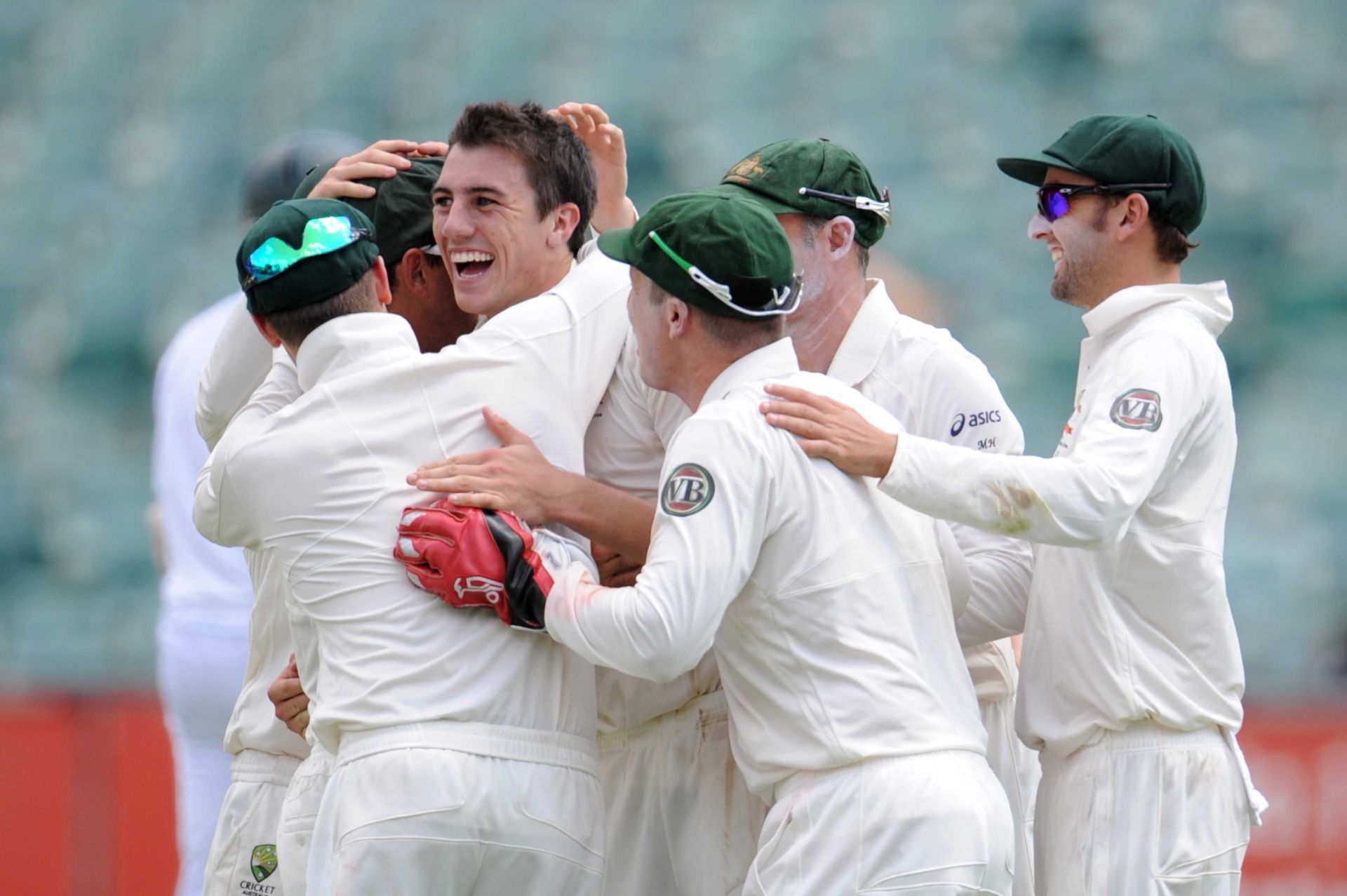 Pat Cummins celebrates his 1st Test wicket with teammates- Hashim Amla. Pic: Getty Images