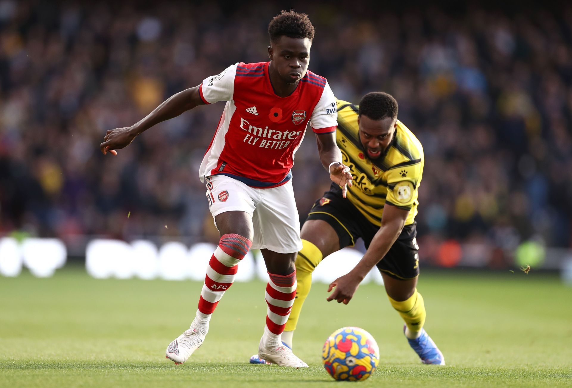 Bukayo Saka (left) takes the ball away from Danny Rose (Watford)