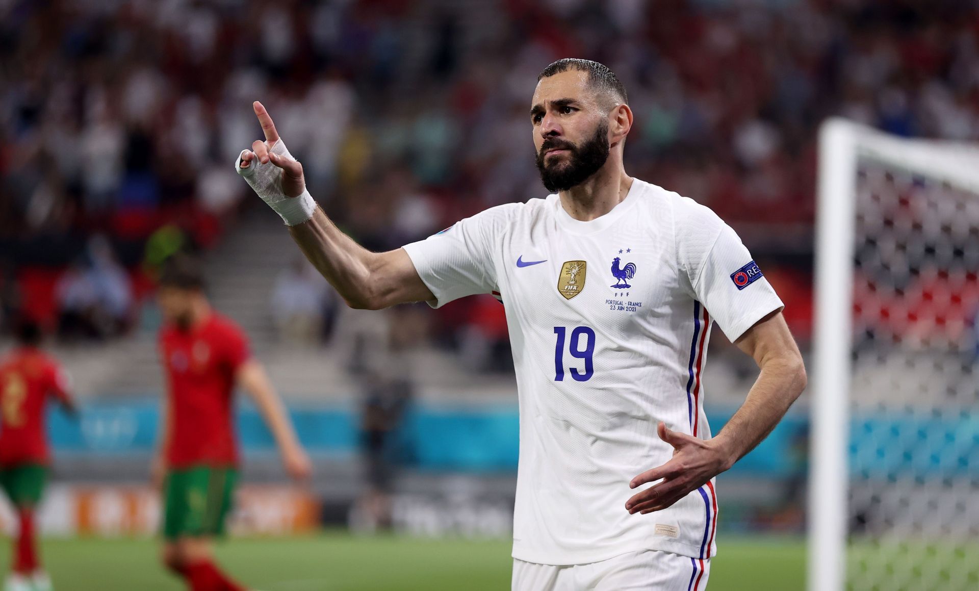 Karim Benzema in disagreement with the linesman during France&#039;s match against Portugal at Euro 2020.
