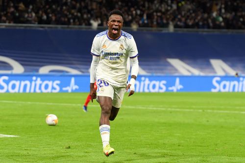 Vinicius Jr celebrates after scoring the winner against Sevilla on Sunday.