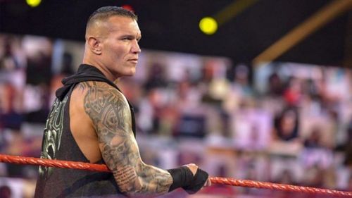 Randy Orton's skull tattoos are visible on both his arms