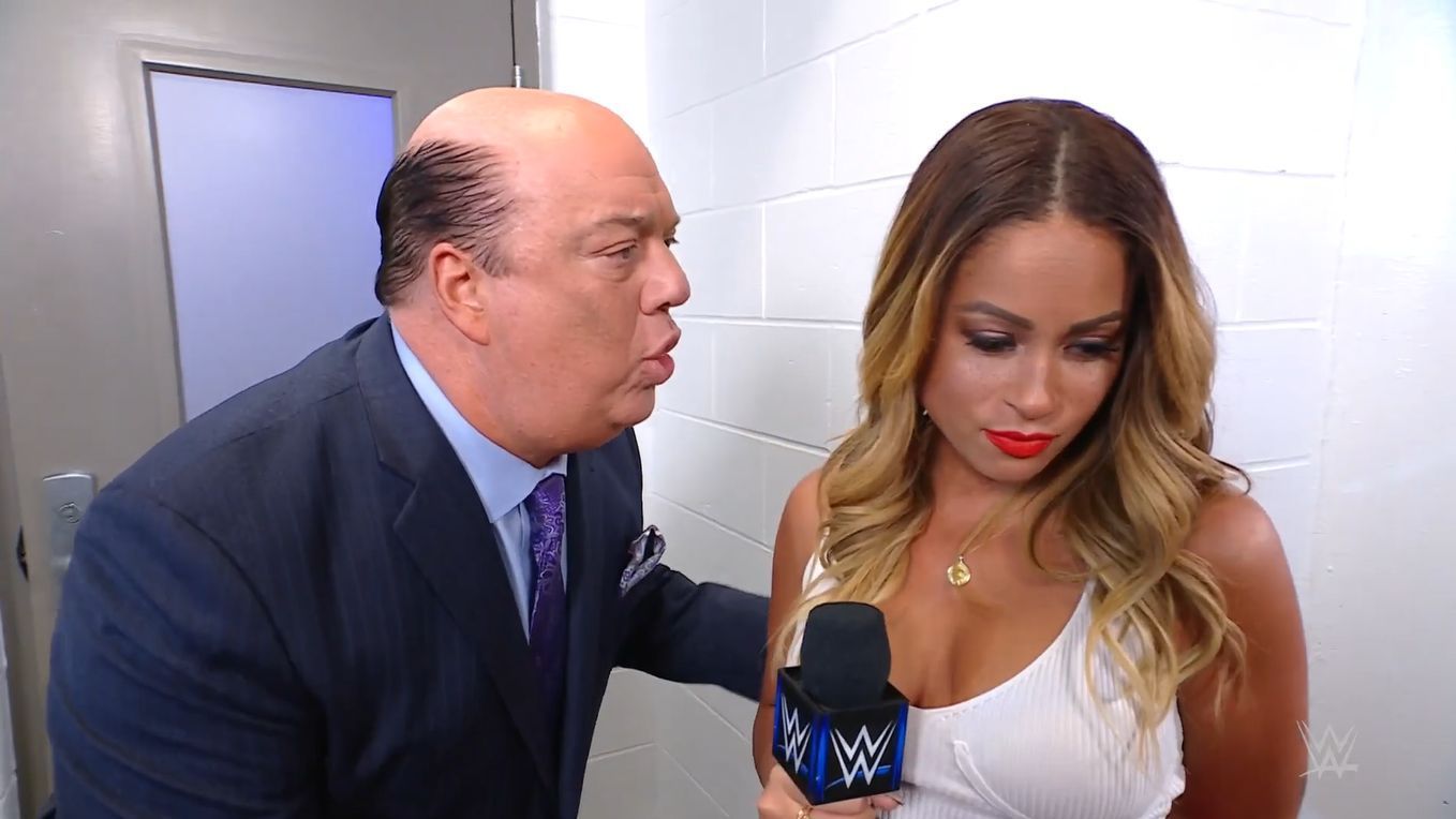 Paul Heyman and Kayla Braxton in a backstage interview segment