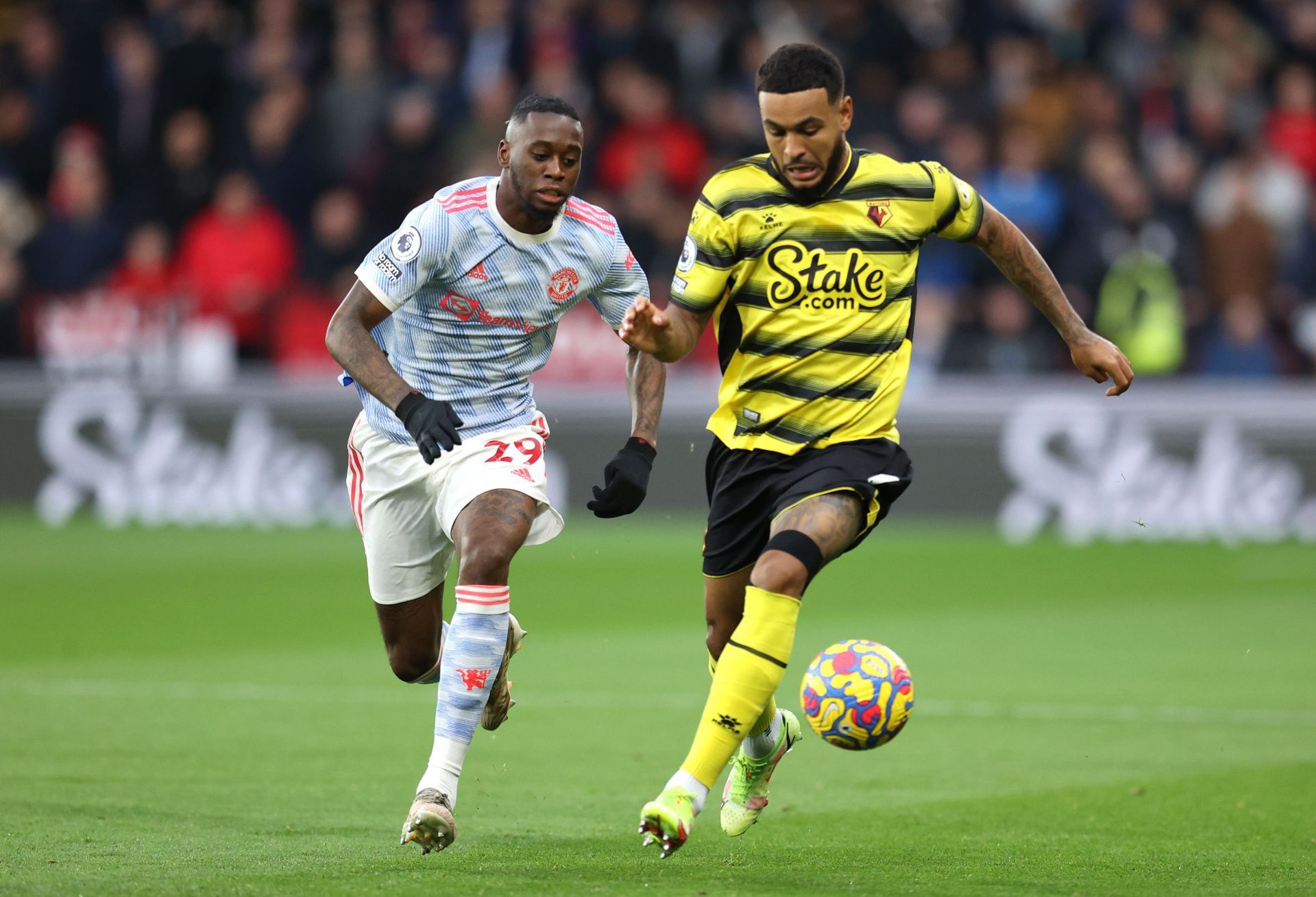 Manchester United&#039;s Aaron Wan-Bissaka (left) in action against Watford City