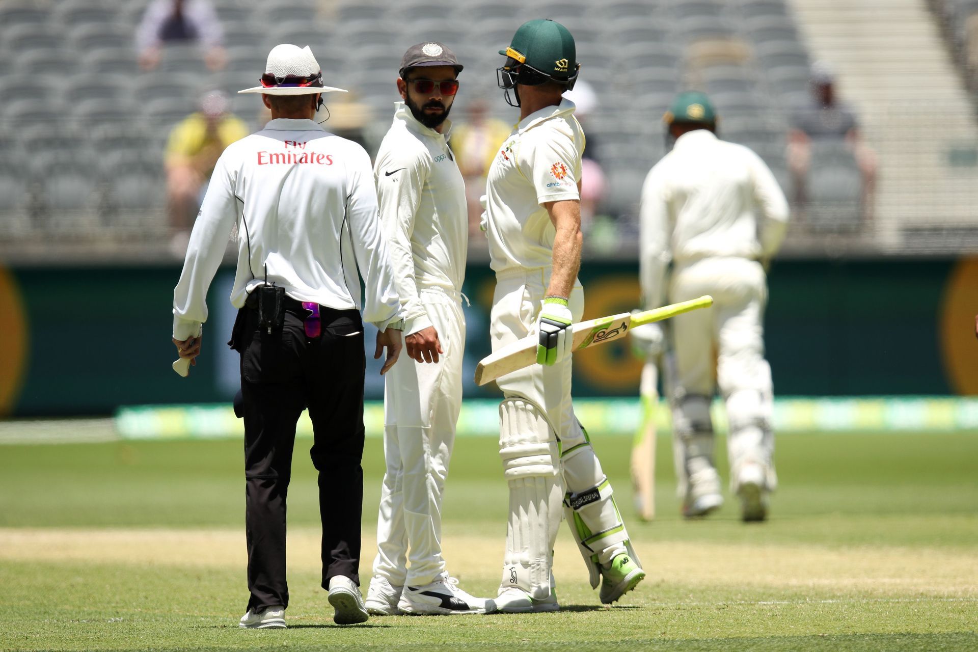 Virat Kohli and Tim Paine bump into each other. Pic: Getty Images