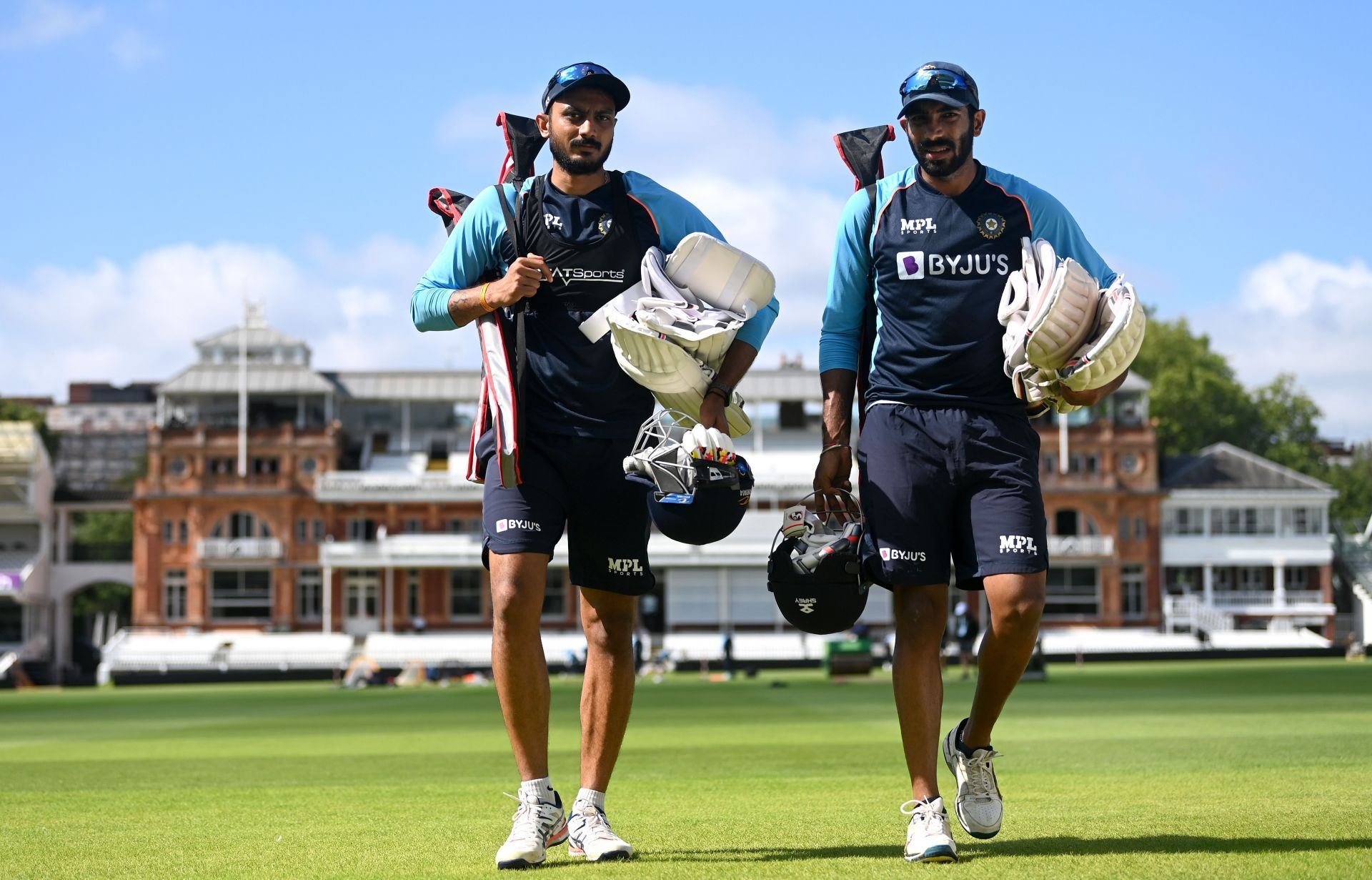 Axar Patel [left] in action during an India nets session