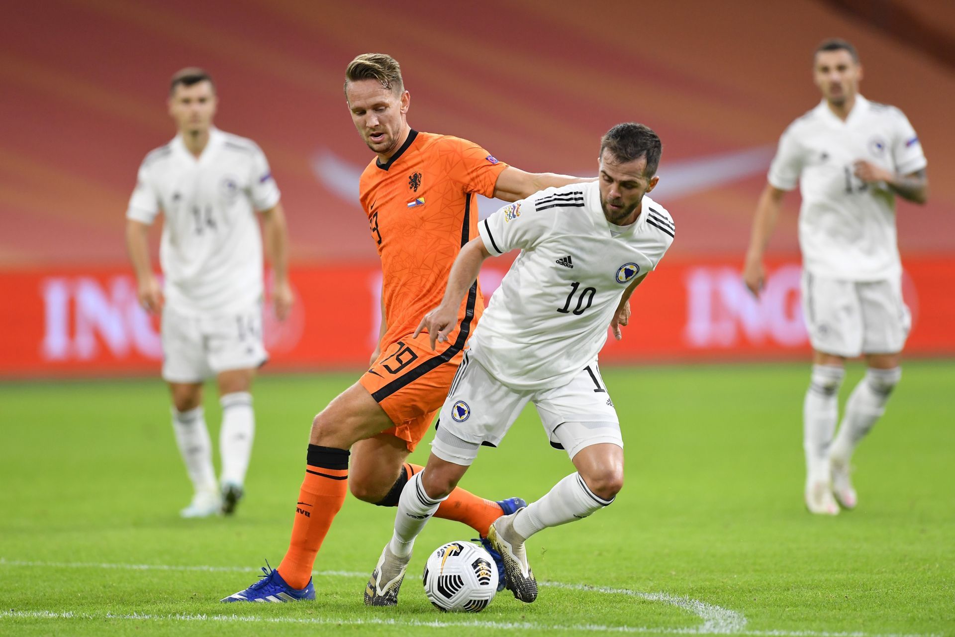 Miralem Pjanic (R) in action for Bosnia