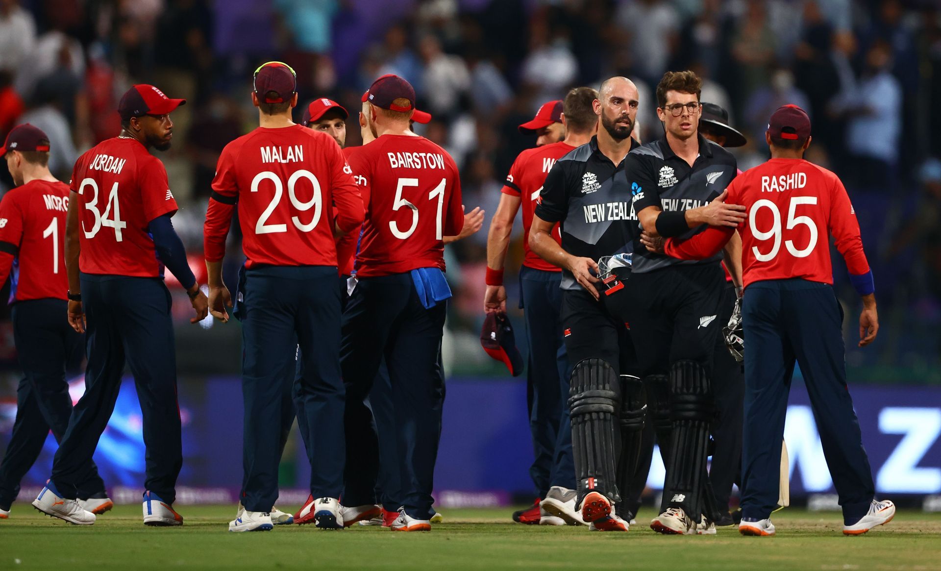 England players congratulate Darryl Mitchell after New Zealand&#039;s semi-final win.