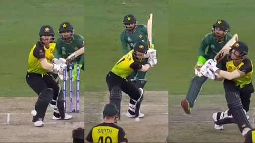 Australian opener David Warner hits Mohammad Hafeez for a six.