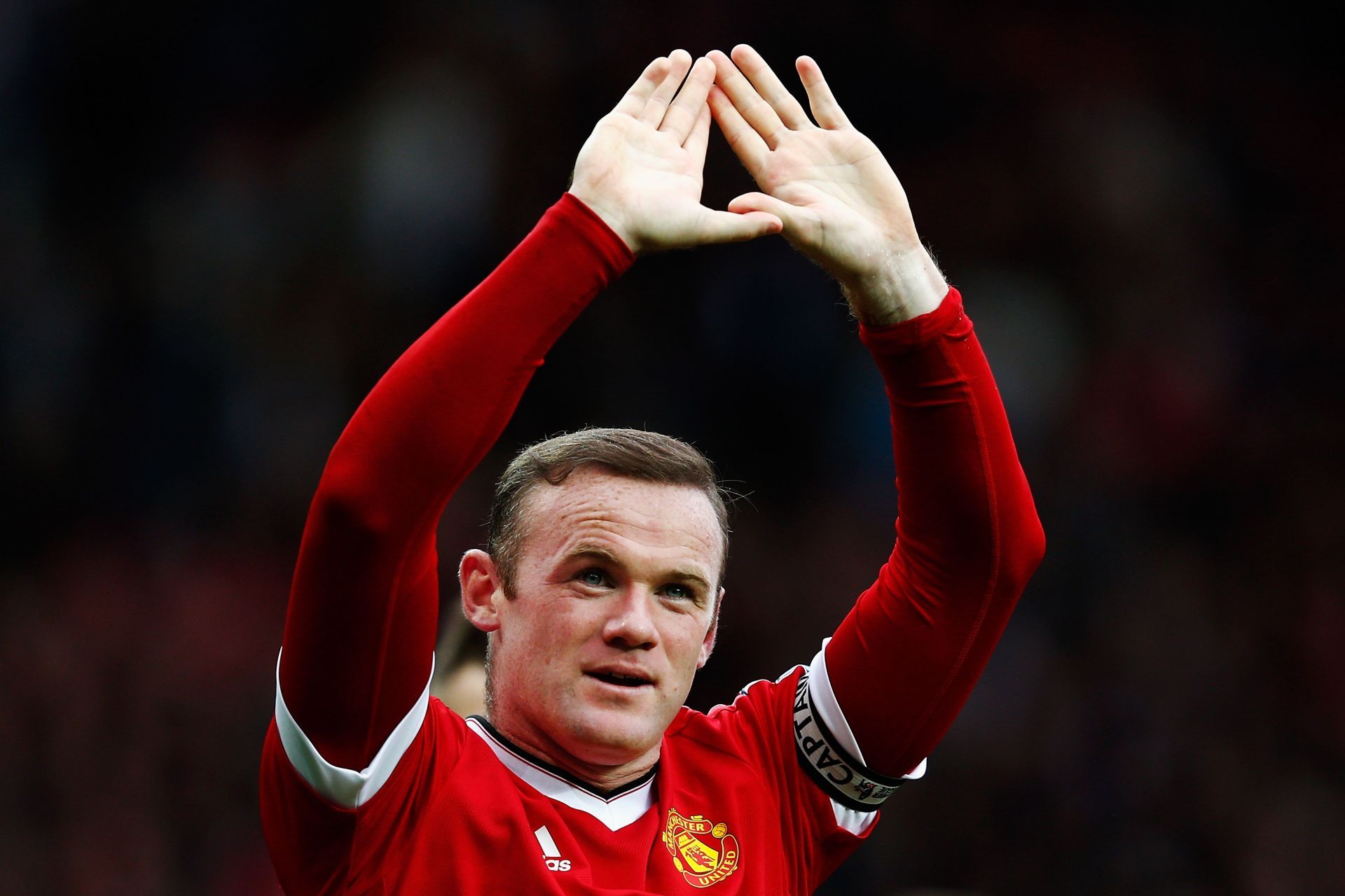 Wayne Rooney acknowledges the home suppiort at Manchester United's Old Trafford stadium..