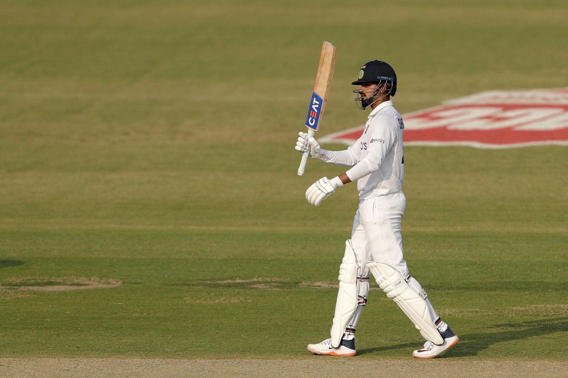Shreyas Iyer celebrating his first Test century in his debut Test match against New Zealand