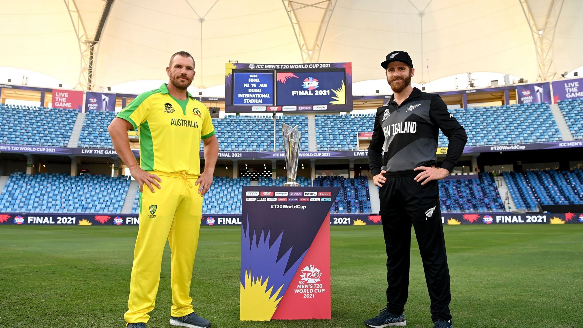 Aaron Finch and Kane Williamson posing with the trophy. (Image: ICC)
