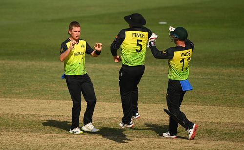 Adam Zampa (left) celebrates the wicket of Afif Hossain. Pic: Getty Images